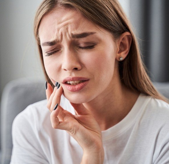 Woman in pain before emergency dentistry