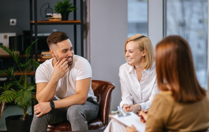 Friends sharing happy healthy smiles after emergency dentistry