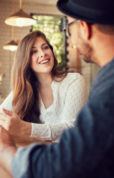 Woman sharing healthy smile after restorative dentistry