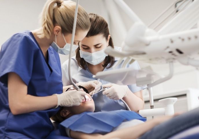 Dentist treating dental patient