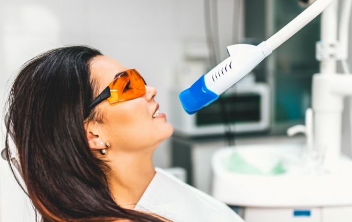 Dental patient receiving in office teeth whitening